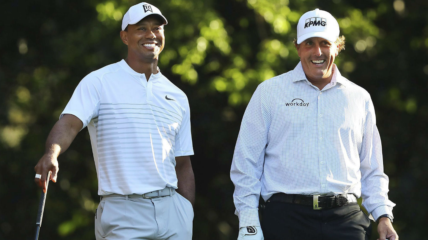 Tiger-Woods,-left,-and-Phil-Mickelson-share-a-laugh-on-the-11th-tee-box-while-playing-a-practice-round-for-the-Masters-golf-tournament-at-Augusta-National-Golf-Club-in-Augusta,-Ga.,-Tuesday,-April-3,-2018.-(Curtis-Compton/AP)