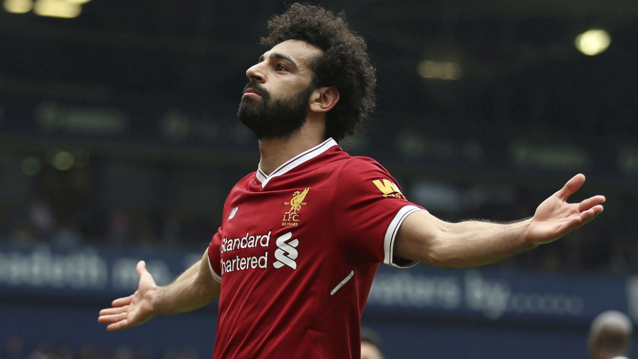 Liverpool's-Mohamed-Salah-celebrates-scoring-his-side's-second-goal-of-the-game,-during-the-English-Premier-League-soccer-match-between-West-Bromwich-Albion-and-Liverpool,-at-The-Hawthorns,-West-Bromwich,-England,-Saturday-April-21,-2018.-(Nigel-French/PA-via-AP)