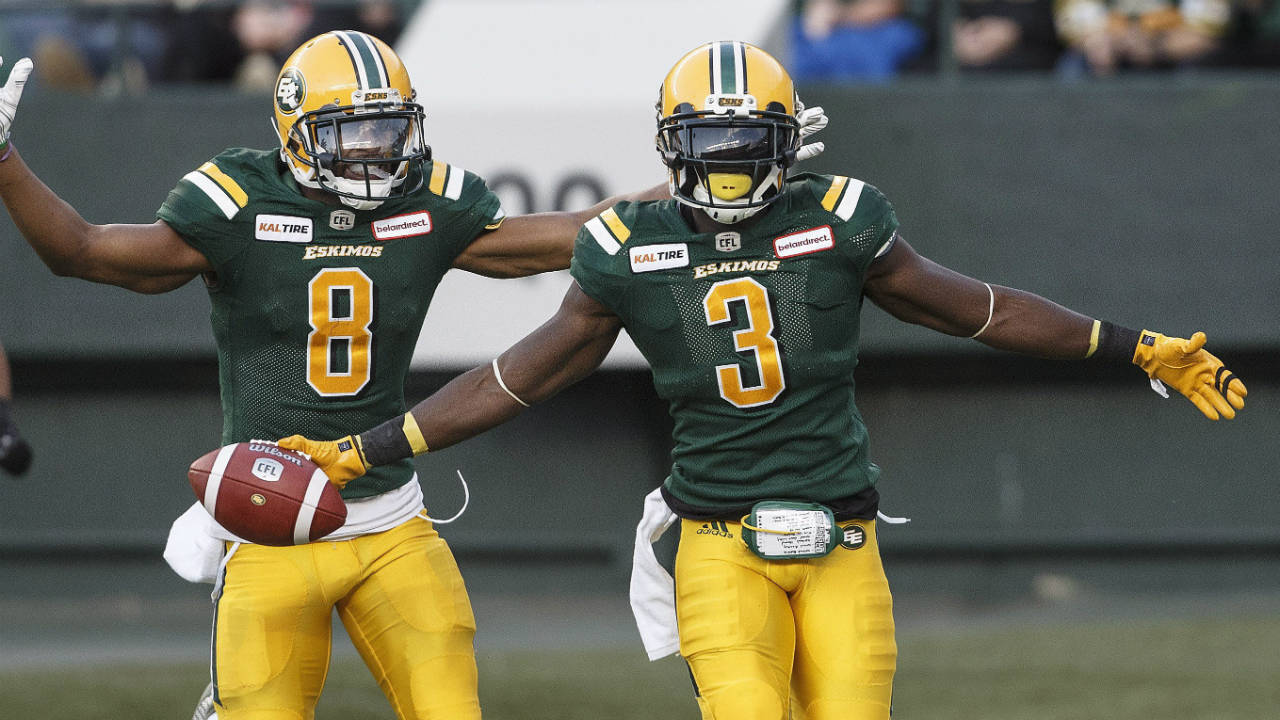 Edmonton-Eskimos-Kenny-Stafford-(8)-and-Natey-Adjei-(3)-celebrate-a-touchdown-against-the-B.C.-Lions-during-first-half-CFL-action-in-Edmonton,-Alta.,-on-Friday-June-29,-2018.-(Jason-Franson/CP)