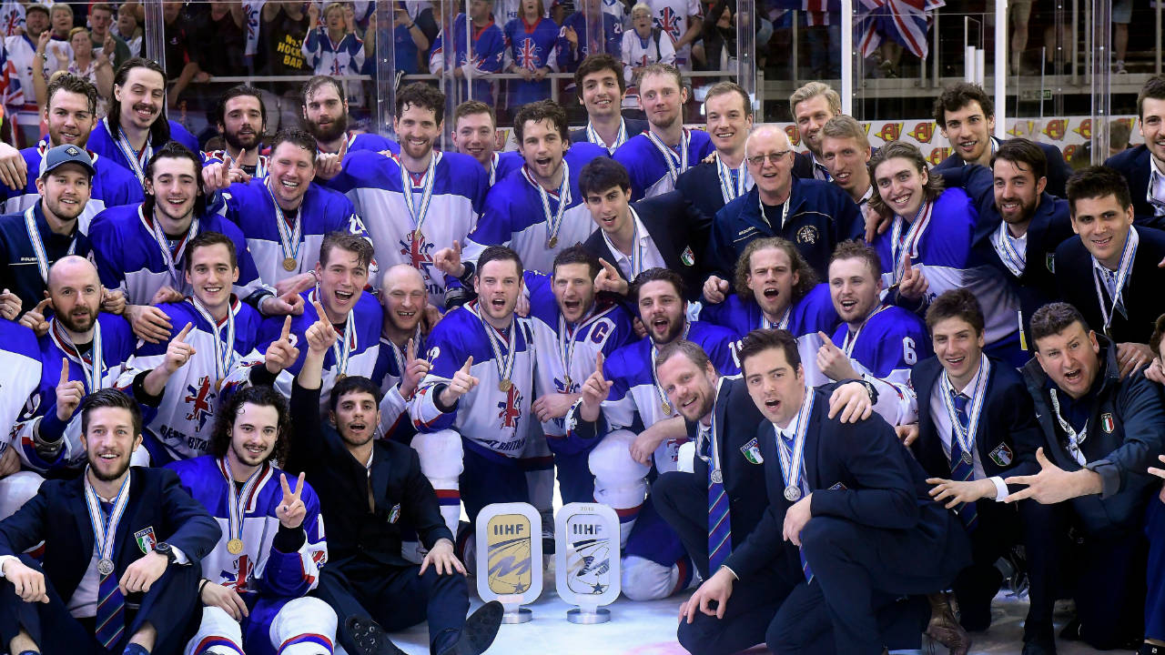 In-this-April-28,-2018-photo-players-of-Great-Britain-celebrate-after-defeating-Hungary-3-2-during-the-men's-hockey-IIHF-World-Championships-Division-I-Group-A-match-in-Papp-Laszlo-Budapest-Sports-Arena-in-Budapest,-Hungary.-Britain-and-Italy-have-qualified-for-the-elite-league.-(Tamas-Kovacs/MTI-via-AP)