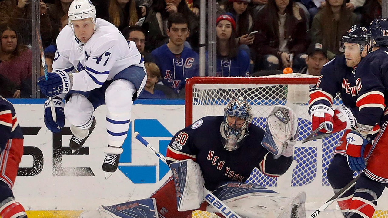 leo-komarov-jumps-in-front-of-henrik-lundqvist