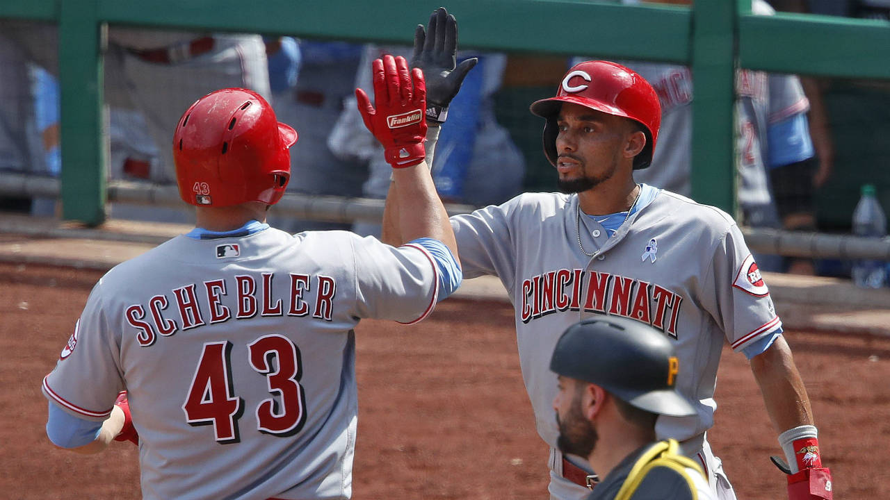 Cincinnati-Reds'-Scott-Schebler-(43)-is-greeted-by-Billy-Hamilton,-right,-rear-after-hitting-a-two-run-home-run-off-Pittsburgh-Pirates-relief-pitcher-Edgar-Santana-in-the-ninth-inning-of-a-baseball-game-in-Pittsburgh,-Sunday,-June-17,-2018.-(Gene-J.-Puskar/AP)