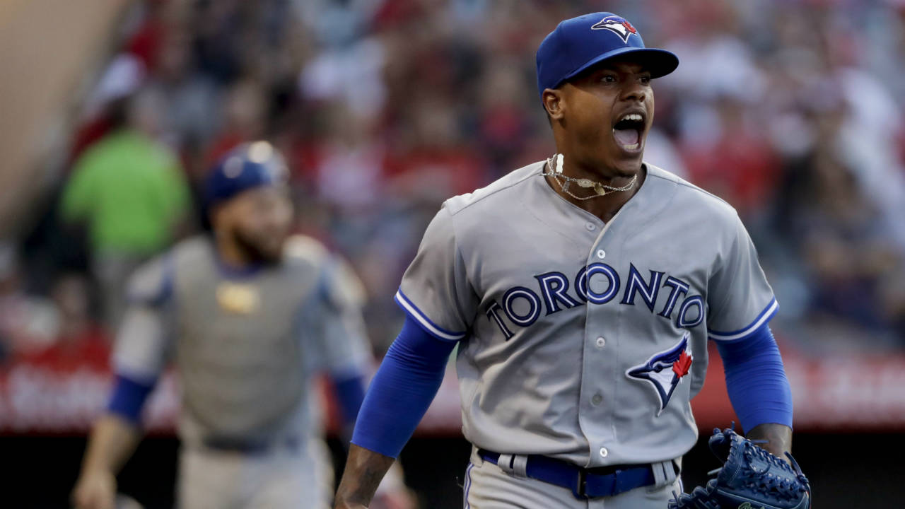 Toronto-Blue-Jays-starting-pitcher-Marcus-Stroman-celebrates-after-getting-the-final-out-with-the-bases-loaded-in-the-third-inning-of-the-team's-baseball-game-against-the-Anaheim-Angels-in-Anaheim,-Calif.,-Saturday,-June-23,-2018.