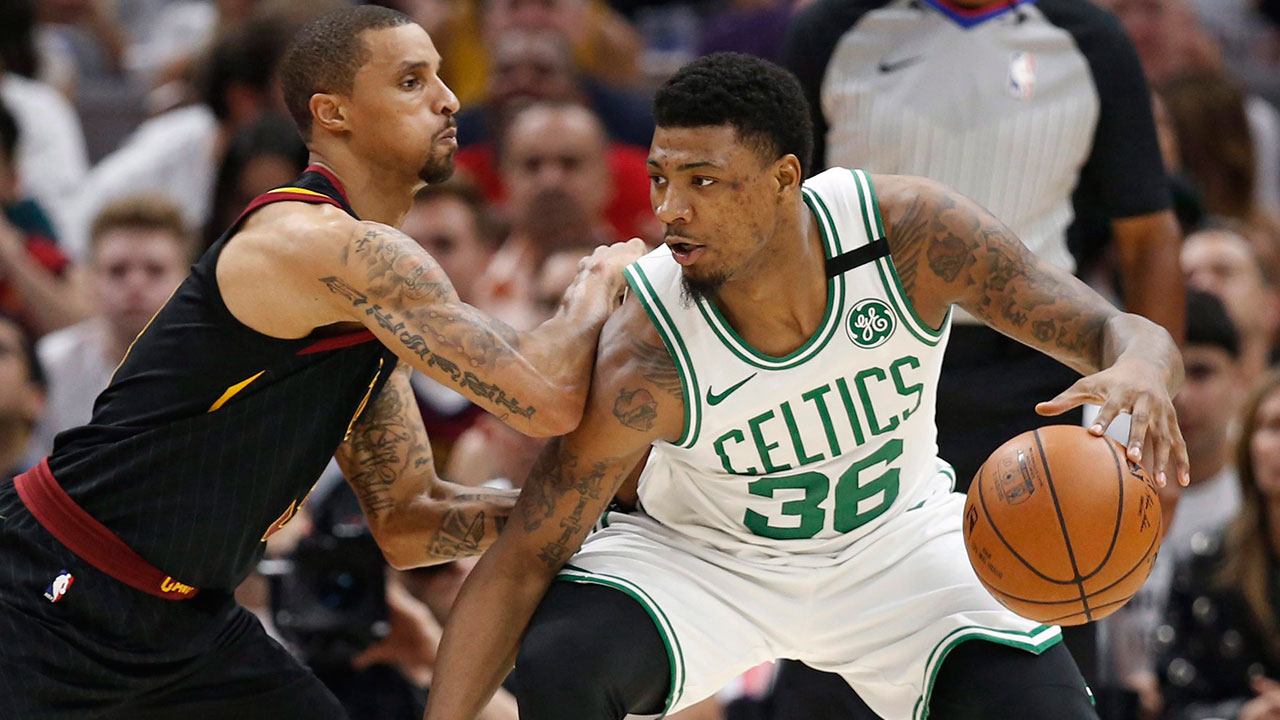 Boston-Celtics-guard-Marcus-Smart-backing-down-Cavaliers-guard-George-Hill