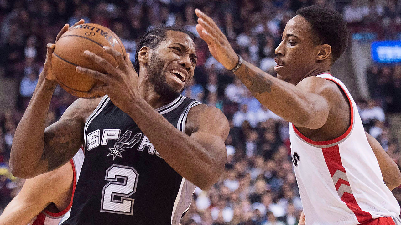 kawhi_leonard_drives_past_demar_derozan
