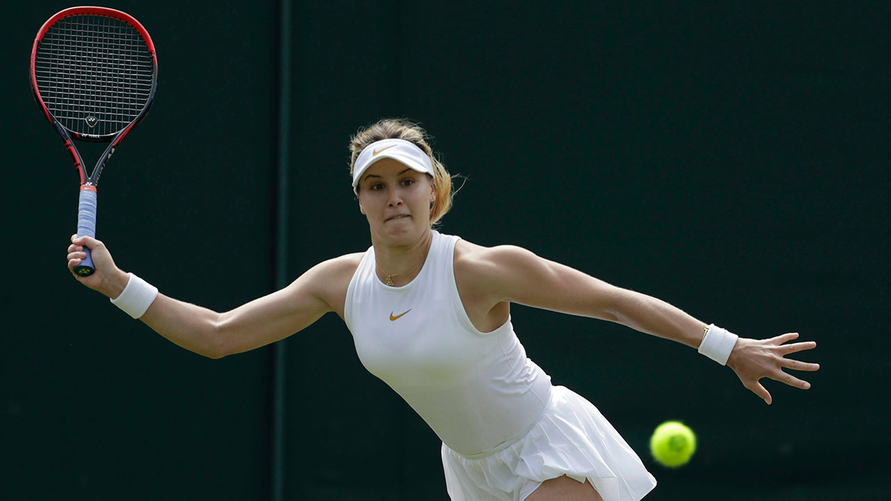 WTA-Bouchard-stretching-to-hit-ball-at-Wimbledon