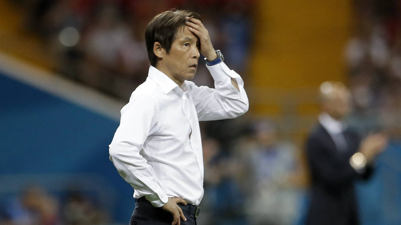 Japan's-head-coach-Akira-Nishino-reacts-in-his-coaching-zone-during-the-round-of-16-match-between-Belgium-and-Japan-at-the-2018-soccer-World-Cup-in-the-Rostov-Arena,-in-Rostov-on-Don,-Russia,-Monday,-July-2,-2018.