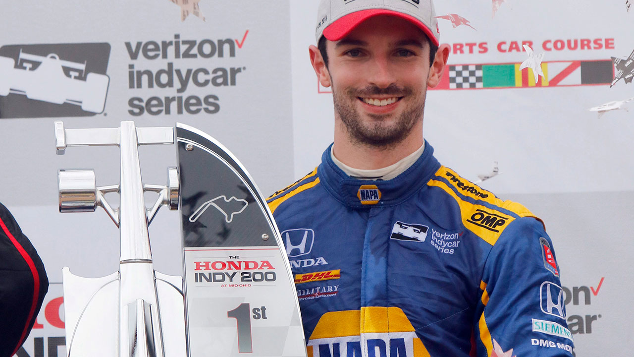 alexander_rossi_poses_with_his_trophy