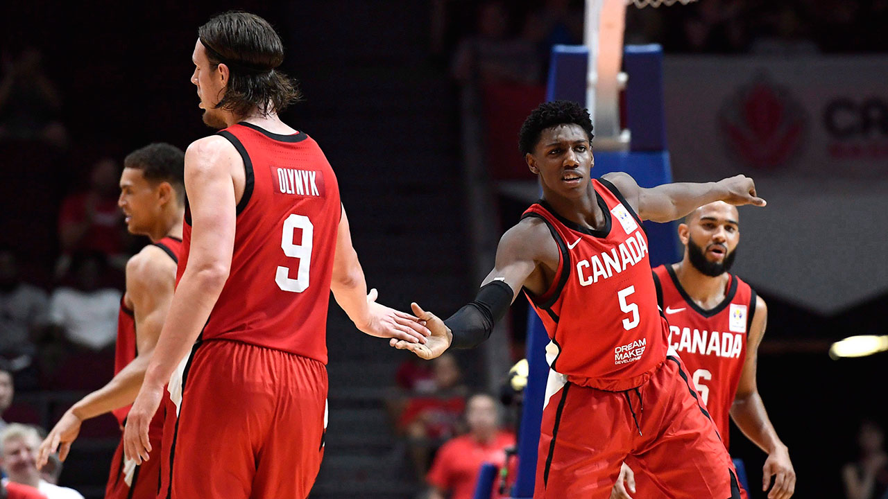 rj_barrett_gives_kelly_olynyk_a_high_five