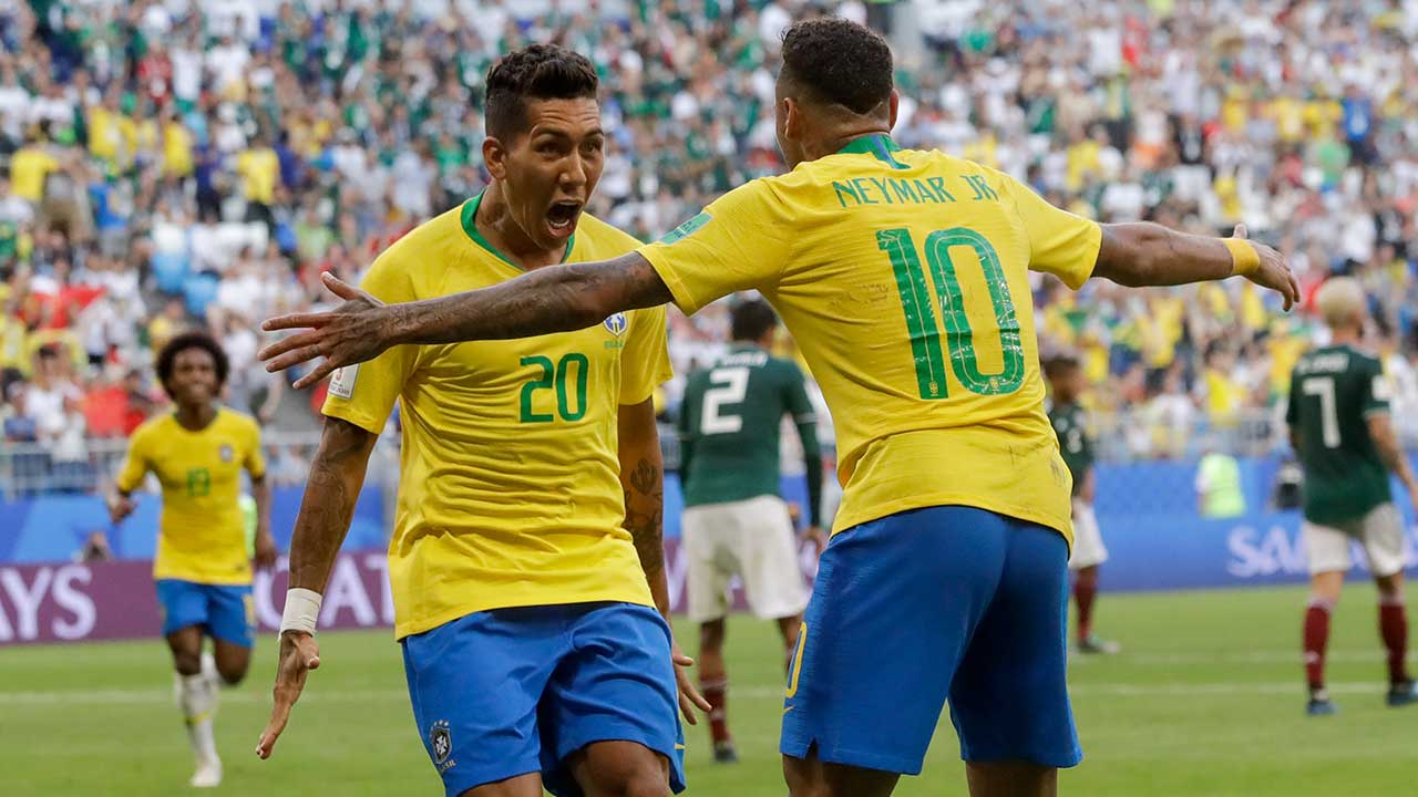 roberto-firmino-celebrates-a-brazil-world-cup-goal-with-neymar