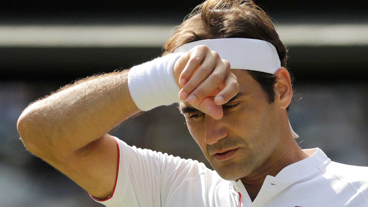 roger-federer-wipes-his-forehead-at-wimbledon