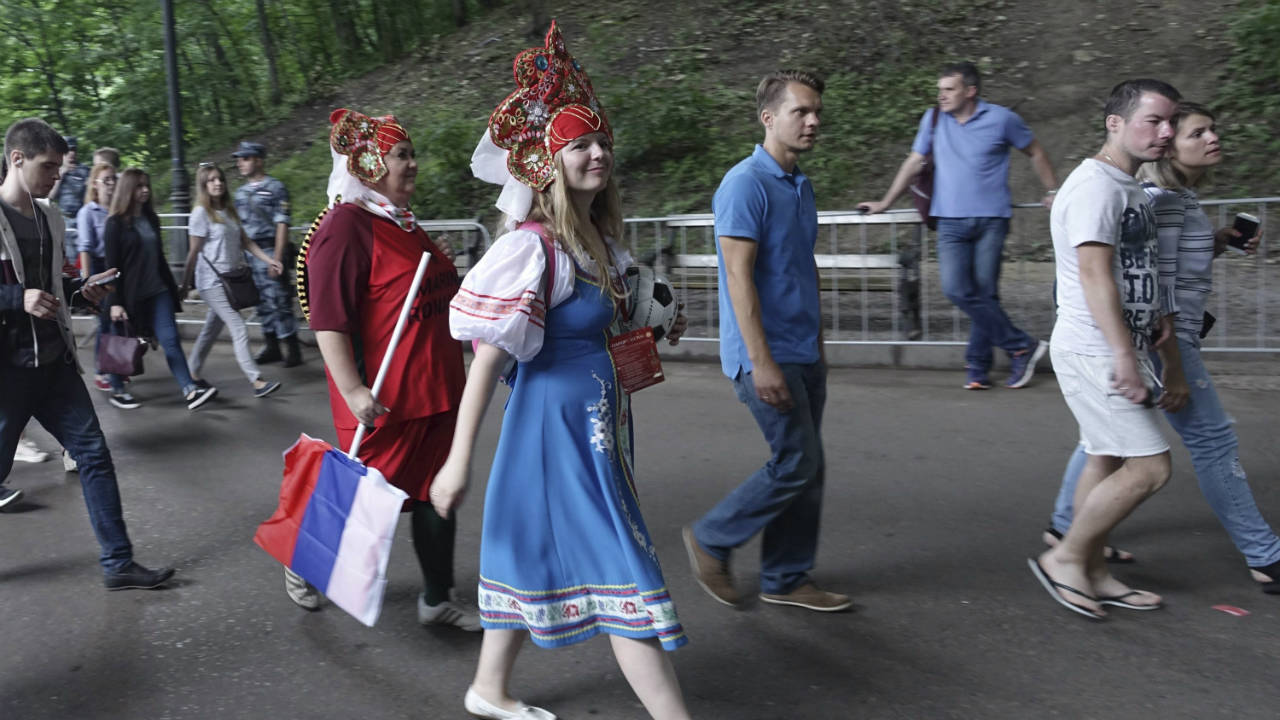 Russian-fans-arrive-to-the-FIFA-Fan-Fest-to-watch-the-round-of-16-match-between-Spain-and-Russia-at-the-2018-soccer-World-Cup-in-Moscow,-Russia,-Sunday,-July-1,-2018.