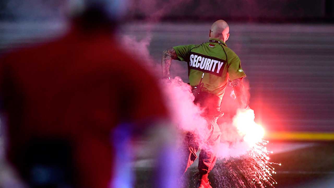 security-guard-runs-while-holding-flare-during-canadian-championship-semifinals