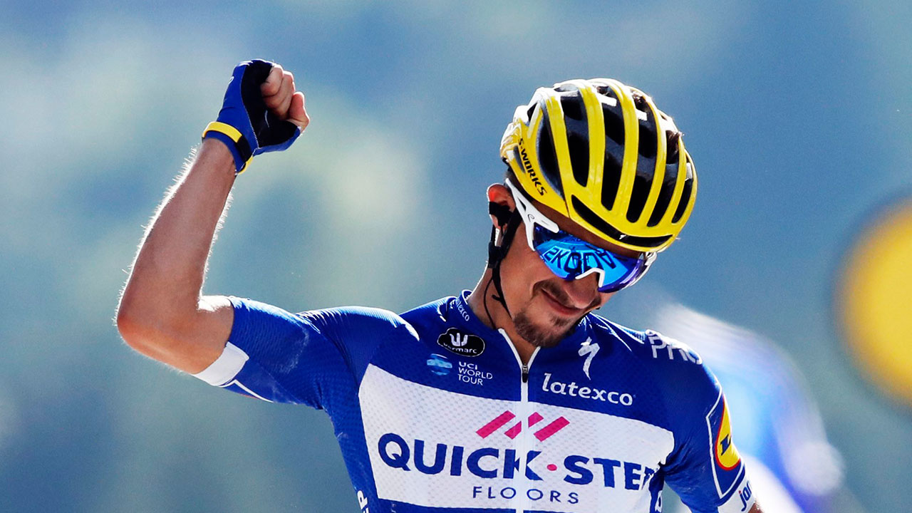 France's Julian Alaphilippe celebrates as he crosses the finish line. (Christophe Ena/AP)