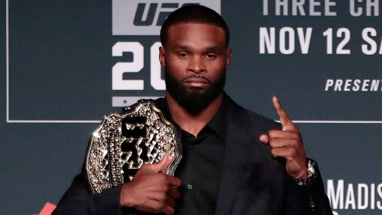 tyron-woodley-poses-with-ufc-title-belt-at-press-conference