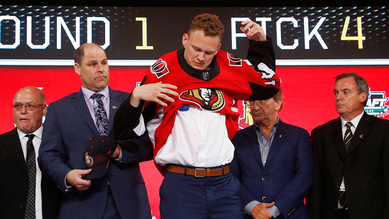 senators-draft-pick-brady-tkachuk-puts-on-jersey-at-draft