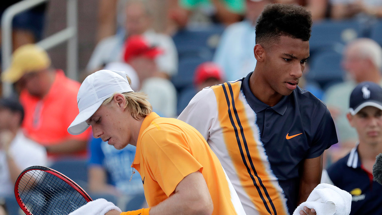 felix-auger-aliassime-and-denis-shapovalov-pass-each-other