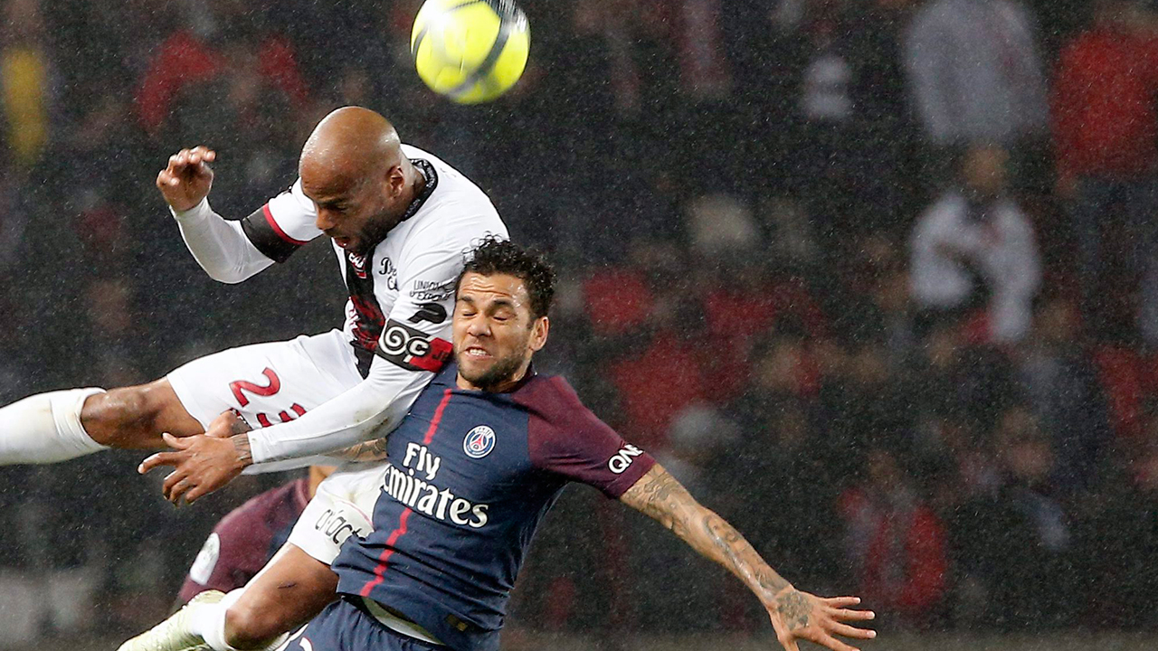 jimmy-briand-jumps-for-the-ball-over-dani-alves