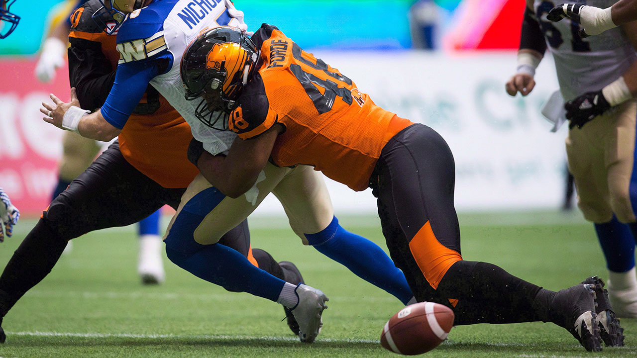 CFL-Lions-Forde-tackles-Bombers-player
