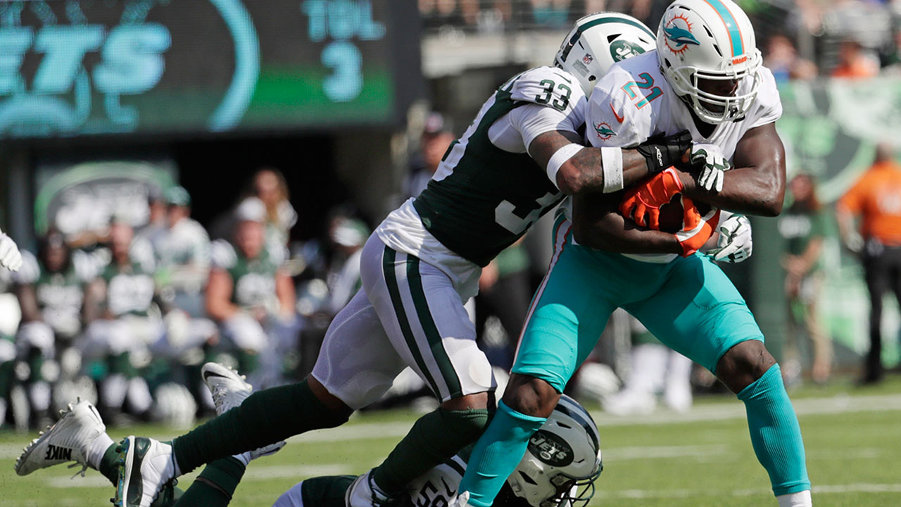 NFL-Dolphins-Gore-gets-tackled-by-Jets