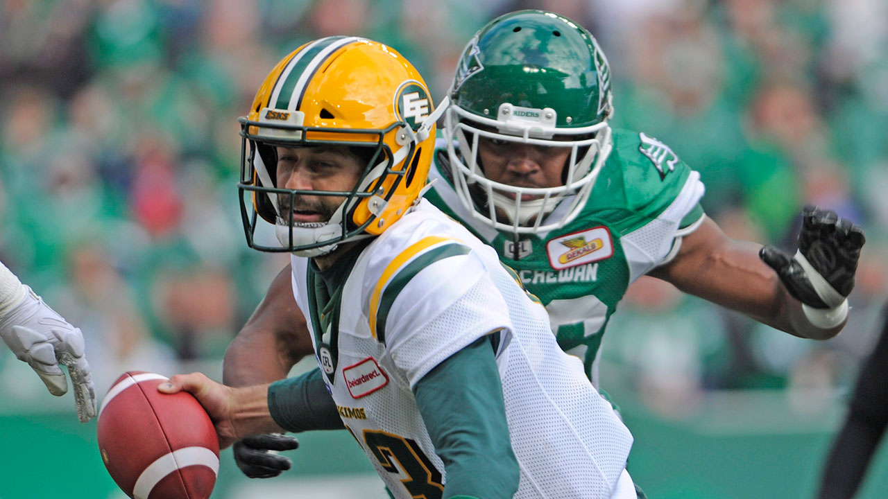 CFL-Eskimos-Reilly-tackled-by-Roughriders-Jefferson