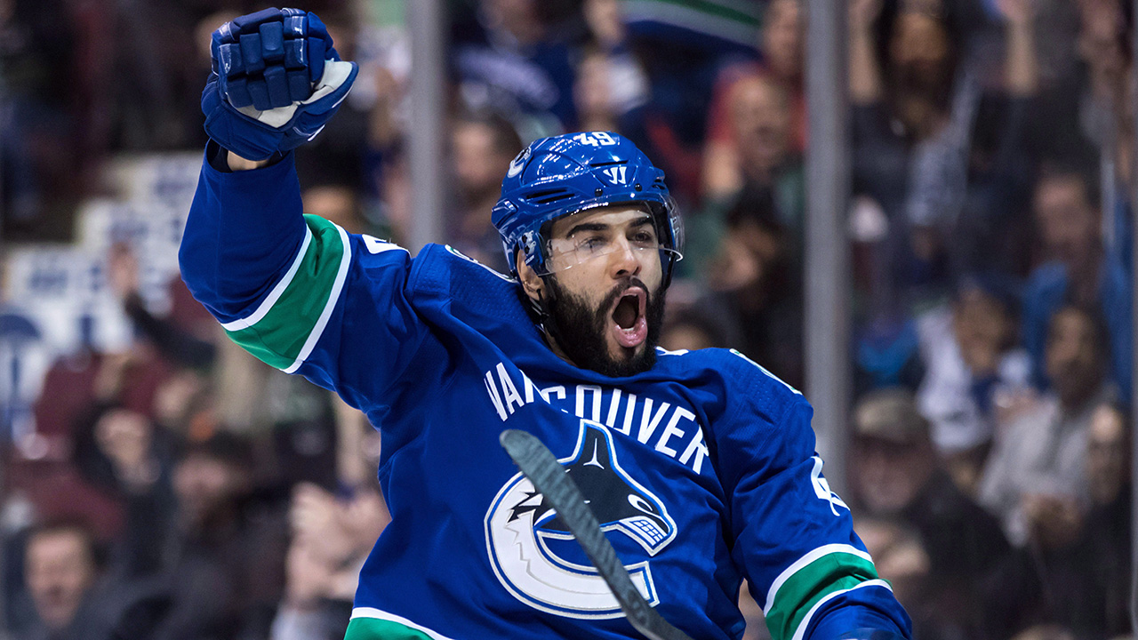 NHL-Canucks-Archibald-celebrates-goal-against-Blue-Jackets