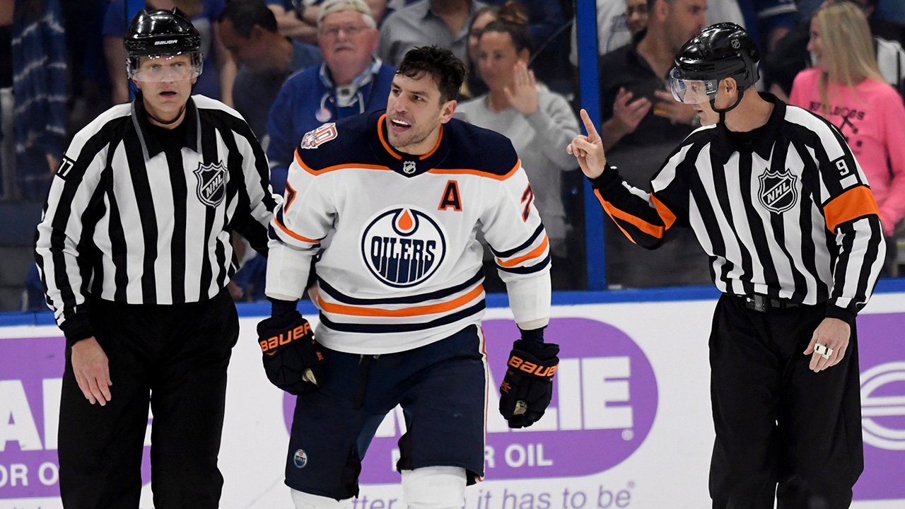 NHL-Oilers-Lucic-skates-alongside-referees