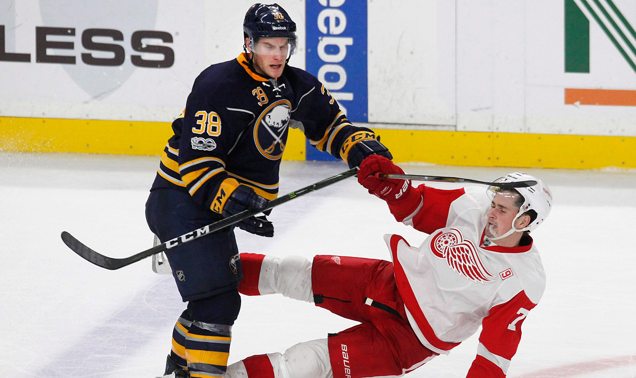 sabres-defenceman-taylor-fedun-checks-red-wings-dylan-larkin