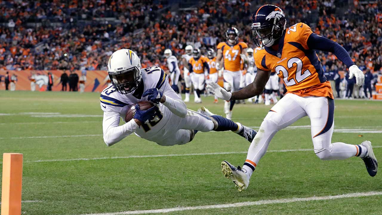 Los Angeles Chargers wide receiver Keenan Allen, left, makes a leaping catch just outside the end zone as Denver Broncos defensive back Tramaine Brock (22) defends during the second half of an NFL football game.
 (Jack Dempsey/AP)