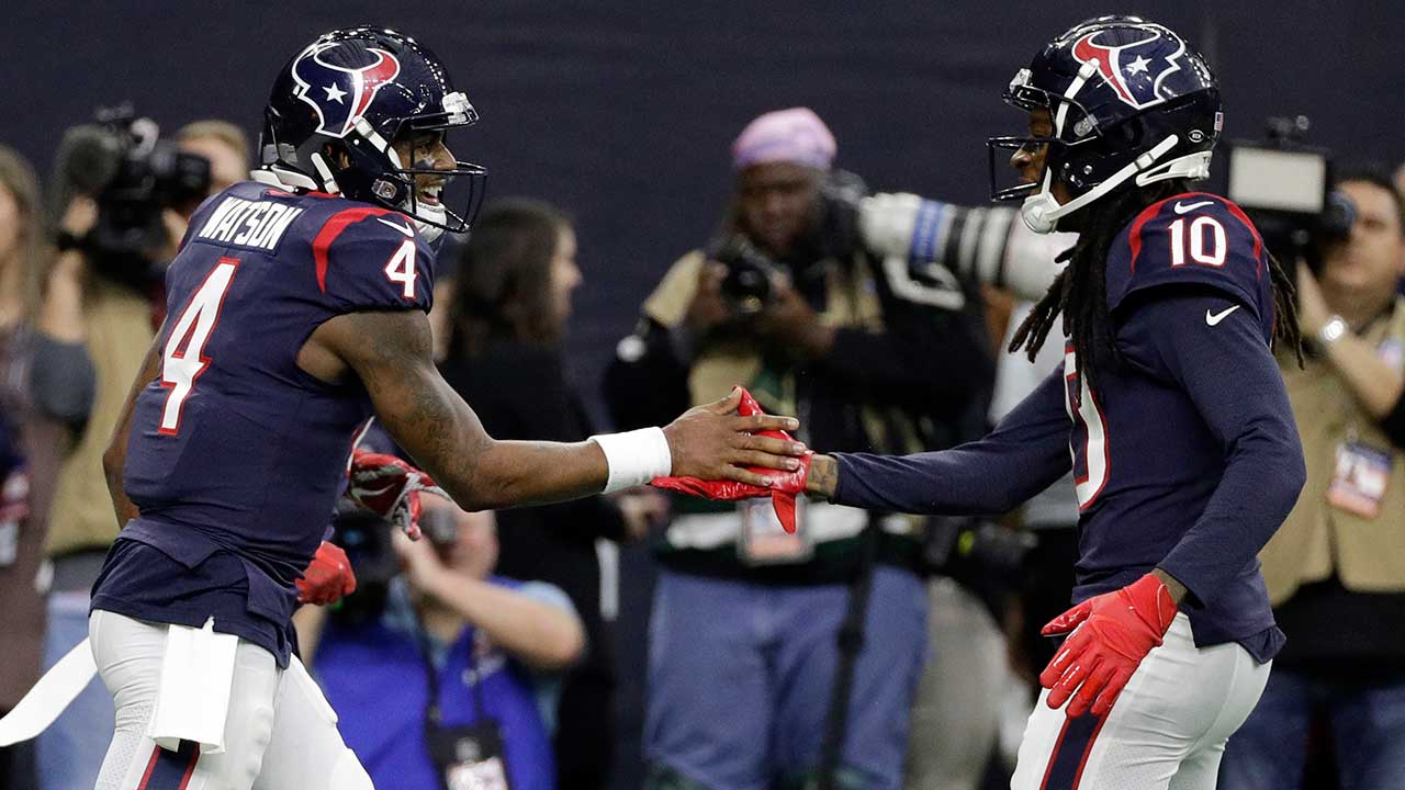 Houston Texans quarterback Deshaun Watson (4) celebrates with teammate DeAndre Hopkins (10) after a touchdown run against the Jacksonville Jaguars during the first half of an NFL football game.
 (David J. Phillip/AP)