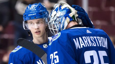Canucks-Pettersson-congratulates-Markstrom-after-win