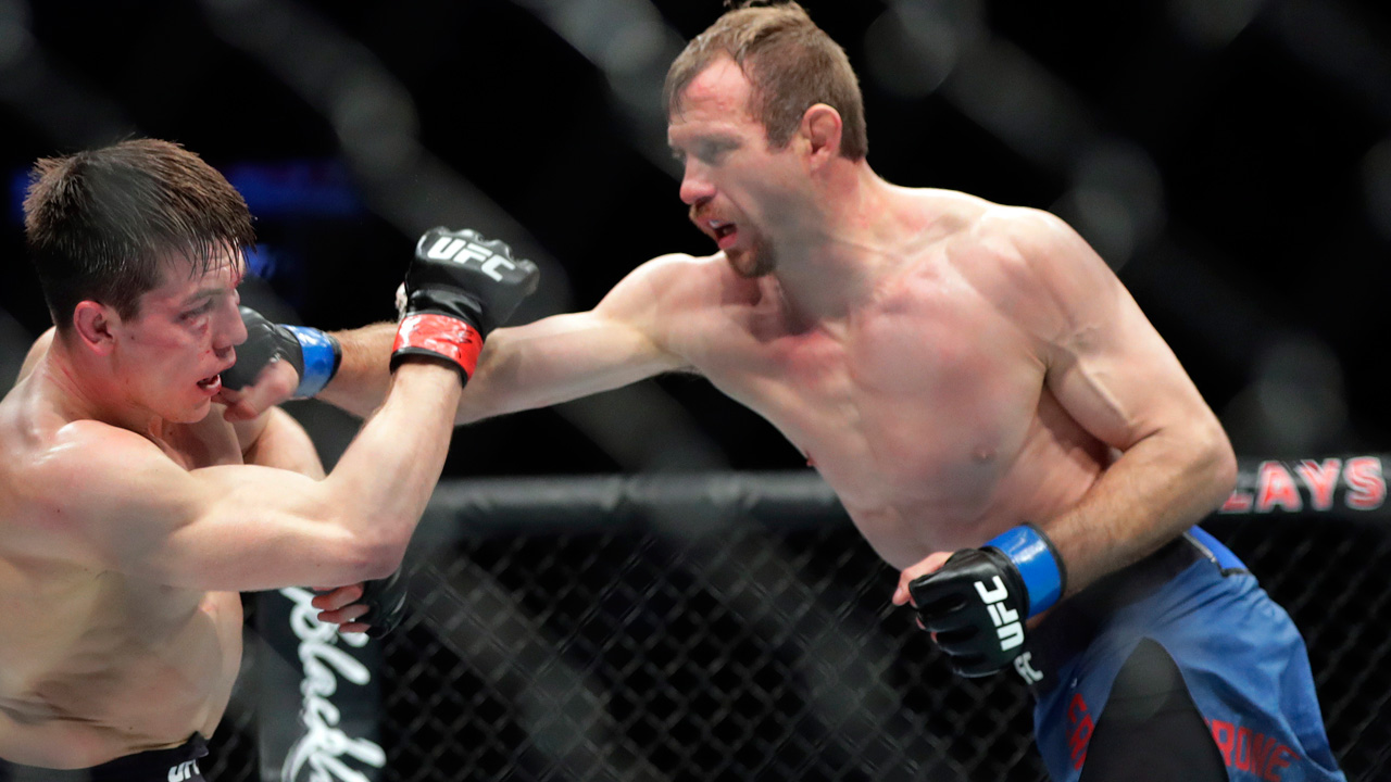 Donald-Cerrone-punches-Alexander-Herenandez