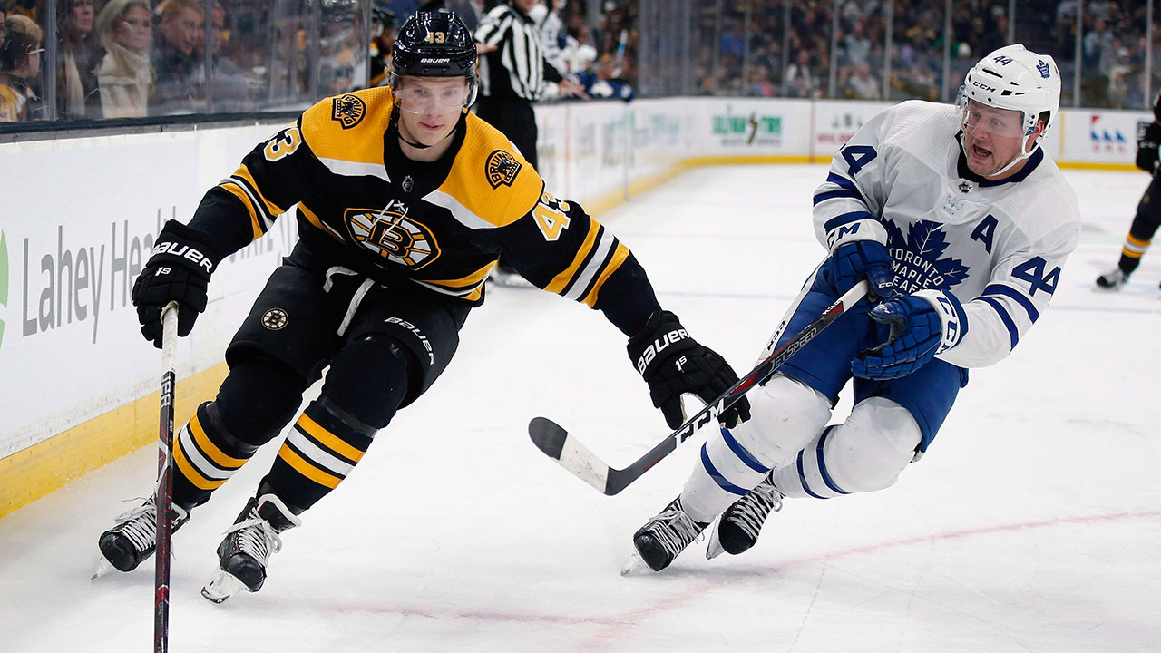 NHL-Maple-Leafs-Rielly-skates-next-to-Bruins-Heinen