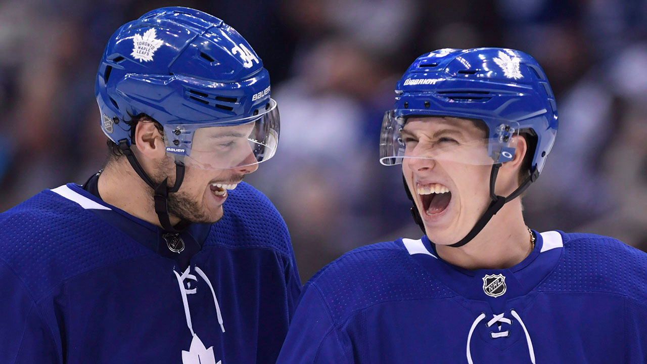 NHL-hockey-Maple-Leafs-Marner-and-Matthews-laugh-after-a-goal