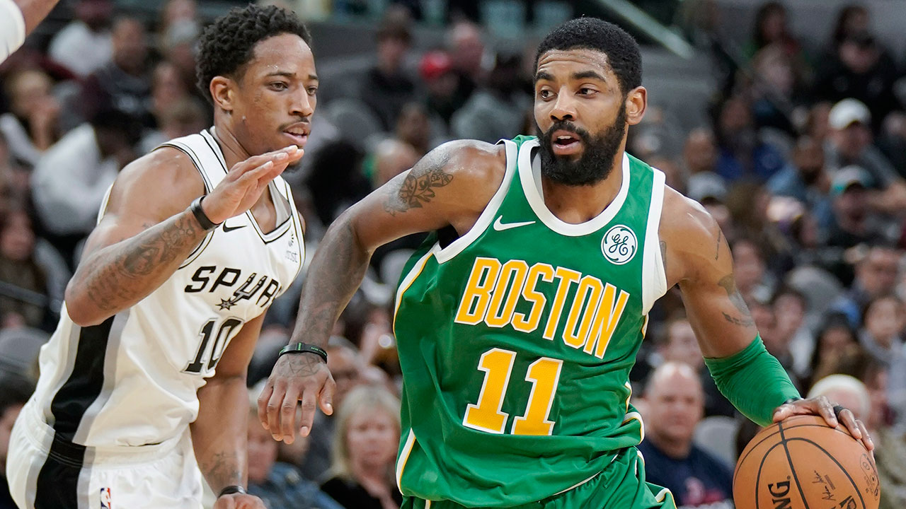 kyrie-irving-drives-by-demar-derozan