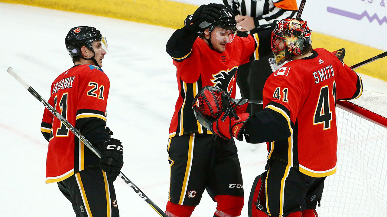 NHL-Flames-Andersson-celebrates-win-with-Smith