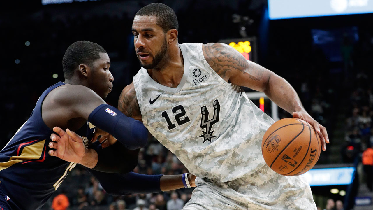 San Antonio Spurs center LaMarcus Aldridge (12) drives around New Orleans Pelicans forward Cheick Diallo during the second half of an NBA basketball game in San Antonio. (Eric Gay/AP)