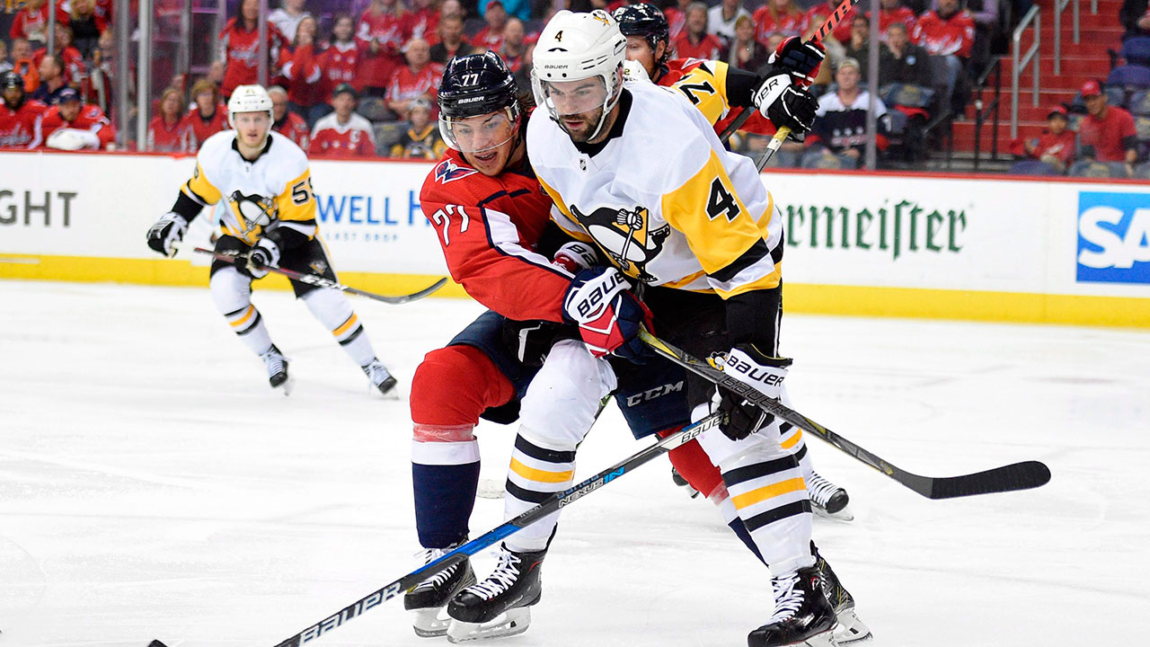 justin-schultz-battles-tj-oshie-for-the-puck