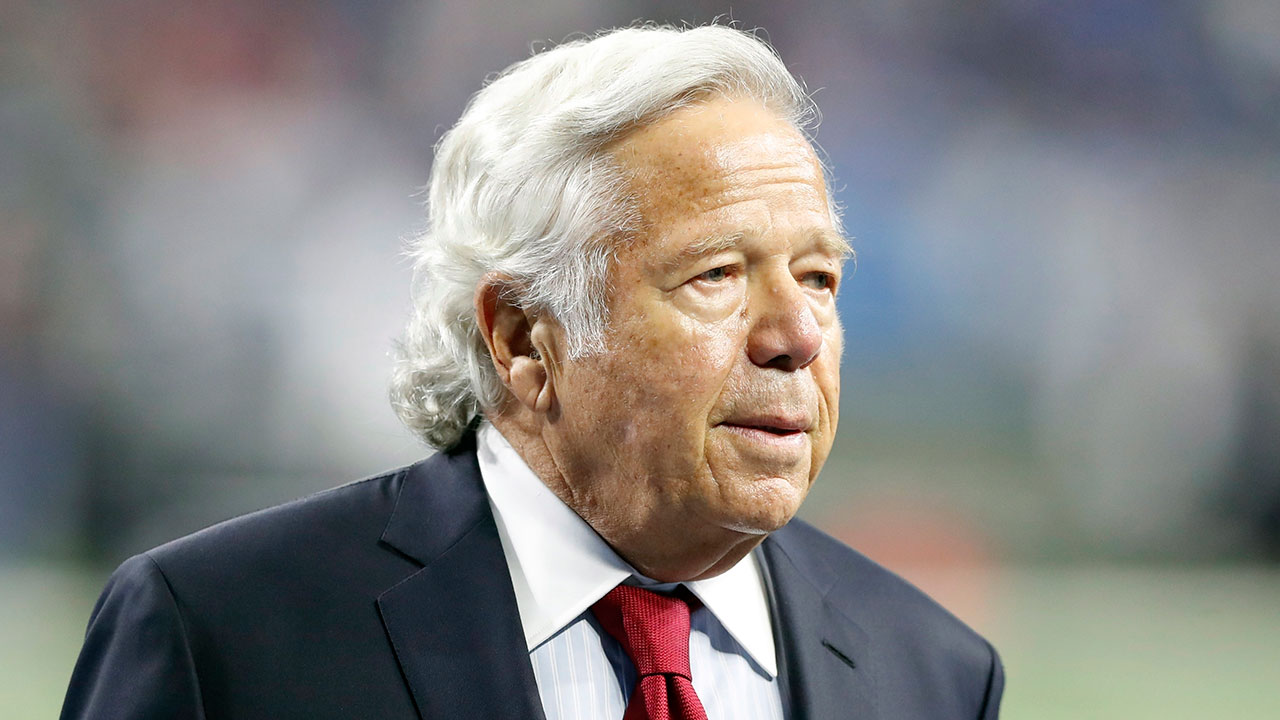 robert-kraft-walks-on-a-field