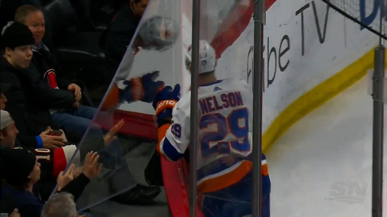 Brady Tkachuk sends Brock Nelson through the glass - HockeyFeed