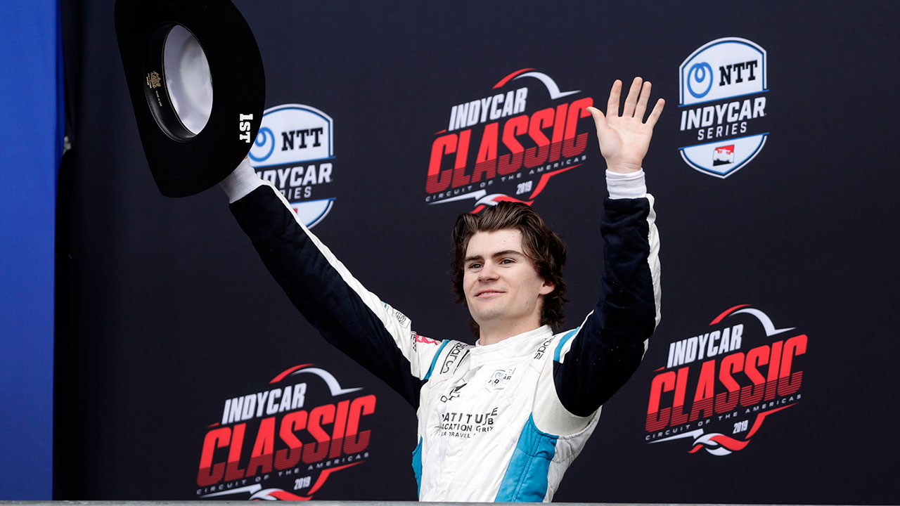 Colton Herta acknowledges cheers from fans after winning the IndyCar Classic auto race. (Eric Gay/AP)