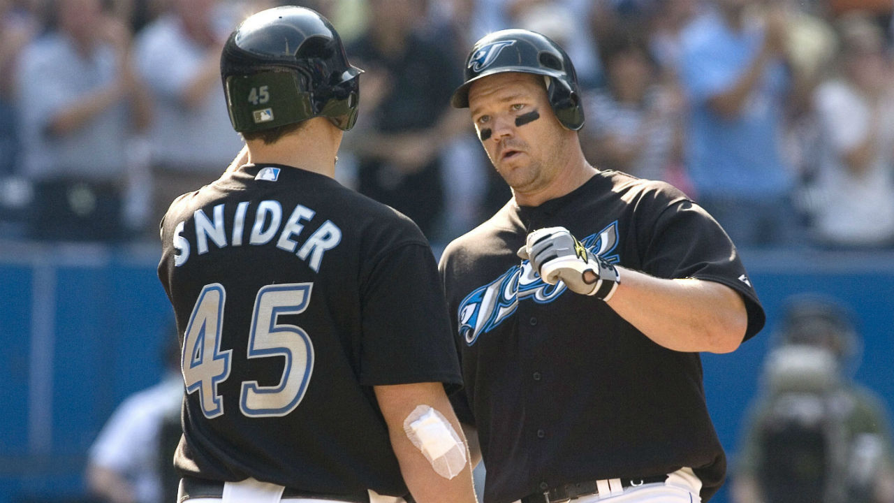 Scott-Rolen-(right)-is-congratulated-by-Travis-Snider,-after-hits-a-solo-home-run,-during-eigth-inning-AL-action-in-Toronto-on-Saturday-September-20th-2008.-THE-CANADIAN-PRESS/Chris-Young