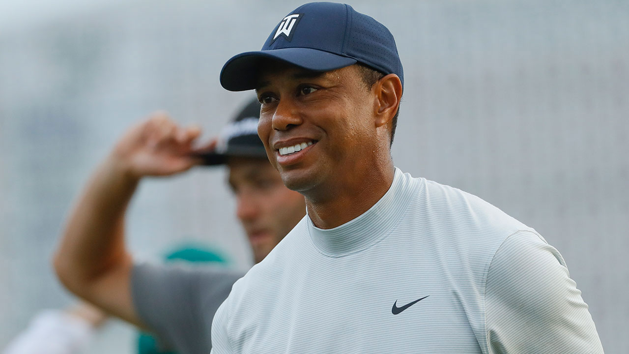 Golf-PGA-Woods-smiles-at-Augusta