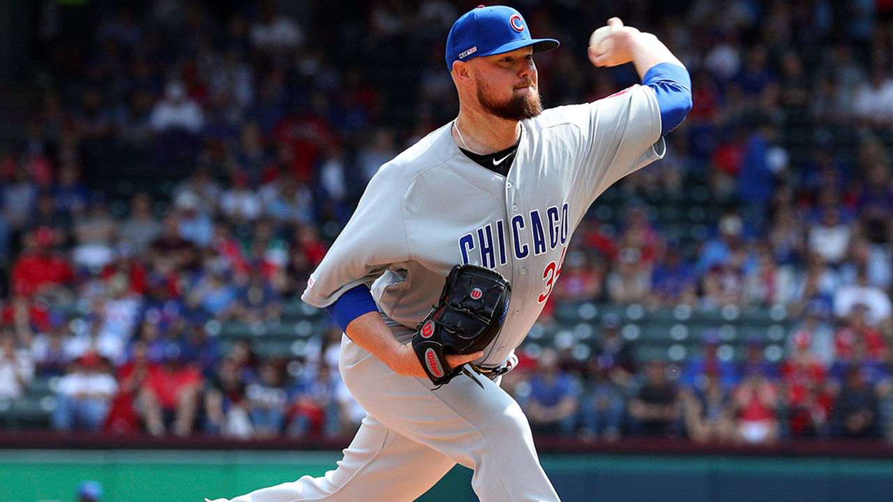 Chicago Cubs starting pitcher Jon Lester (34) delivers a pitch. (Richard W. Rodriguez/AP)