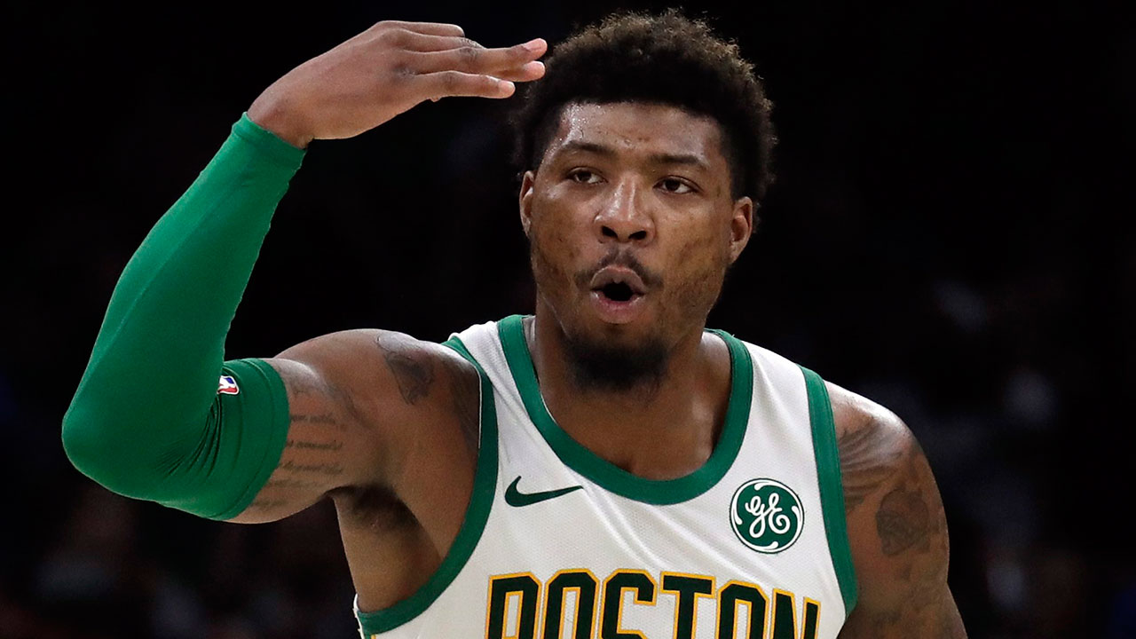 Boston Celtics guard Marcus Smart celebrates his 3-point shot. (Elise Amendola/AP)