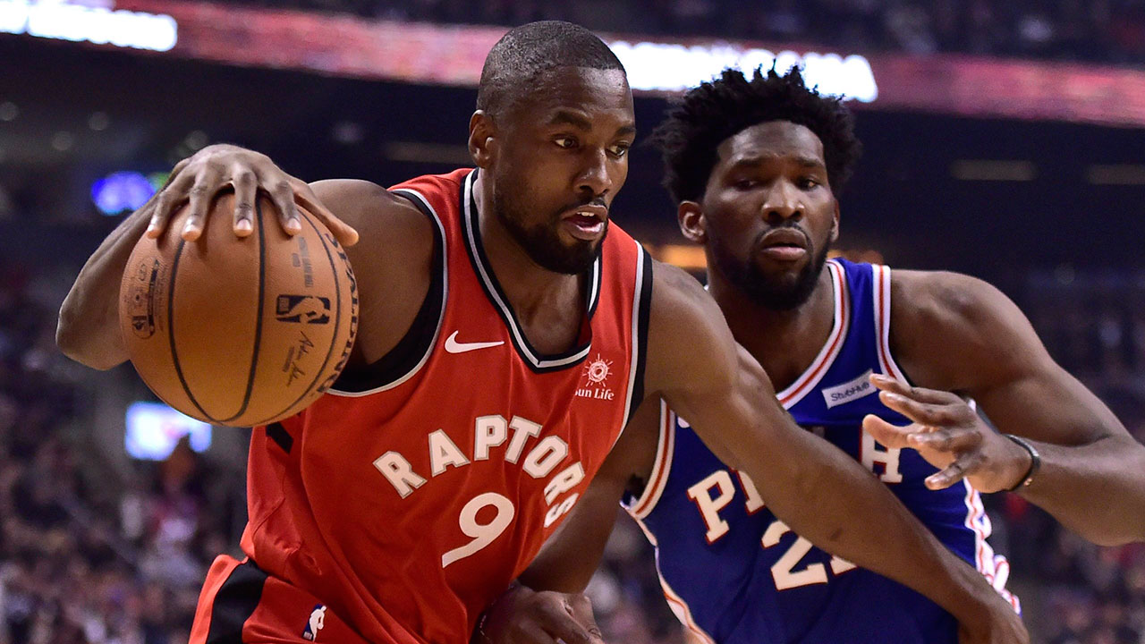 NBA-Raptors-Ibaka-drives-against-Sixers-Embiid