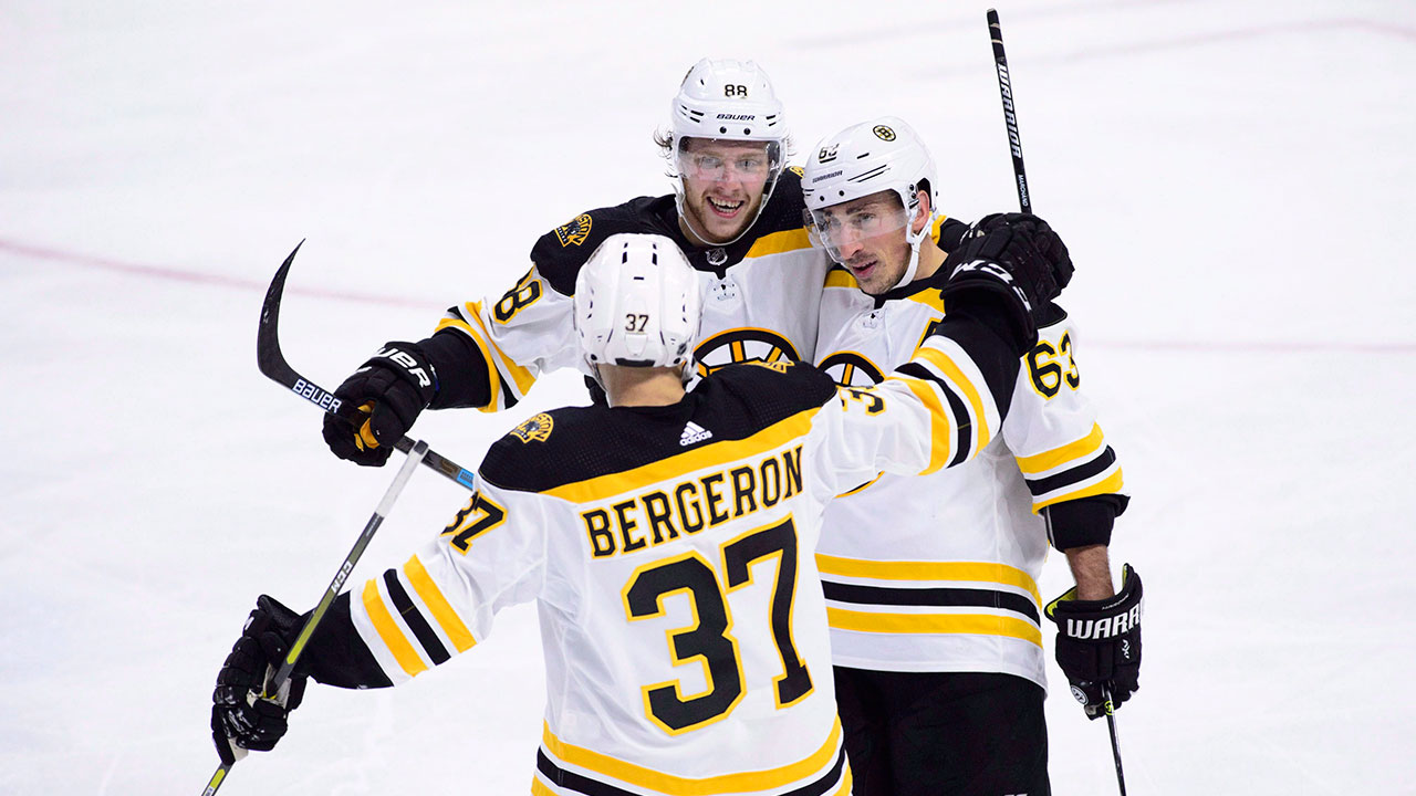 NHL-Bruins-top-line-celebrates-goal