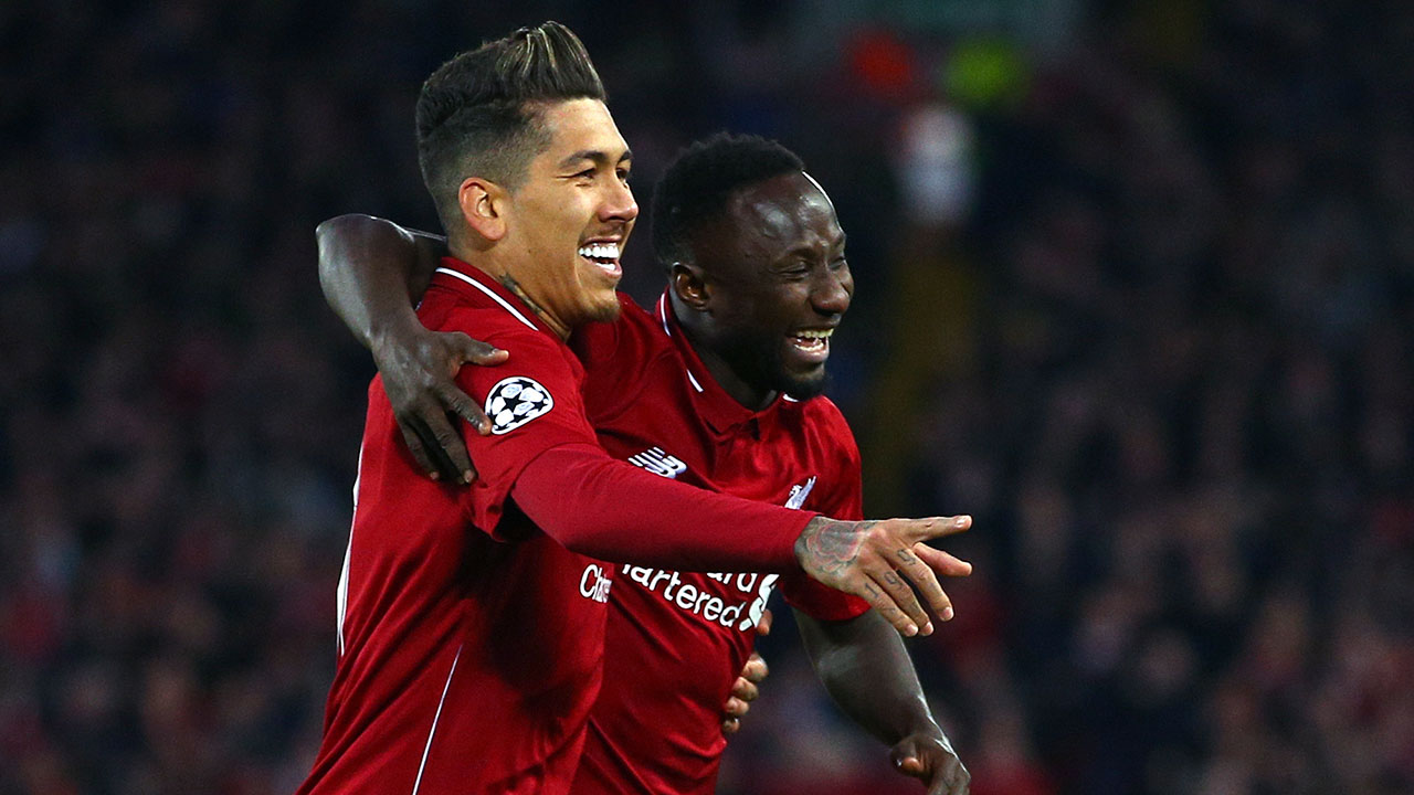 Liverpool's Naby Keita celebrates with Roberto Firmino, left, after scoring the opening goal during the Champions League quarterfinal, first leg, soccer match between Liverpool and FC Porto. (Dave Thompson/AP)
