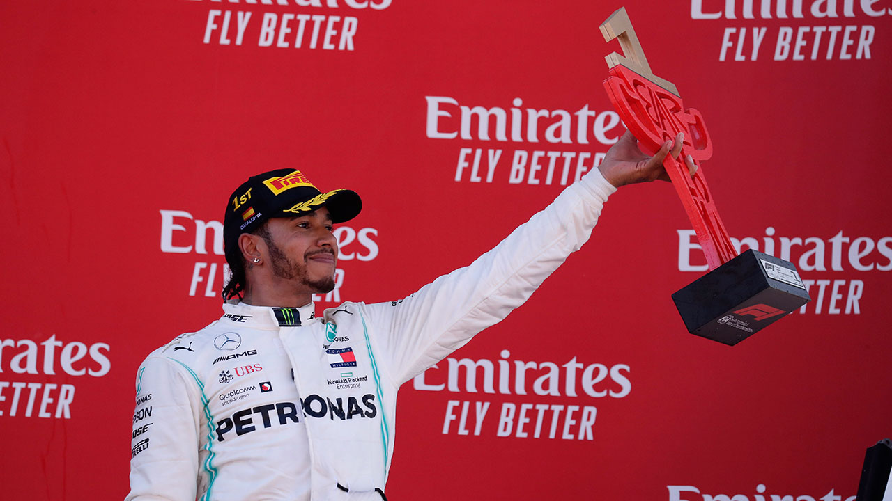 Auto-racing-F1-Hamilton-celebrates-after-winning-race