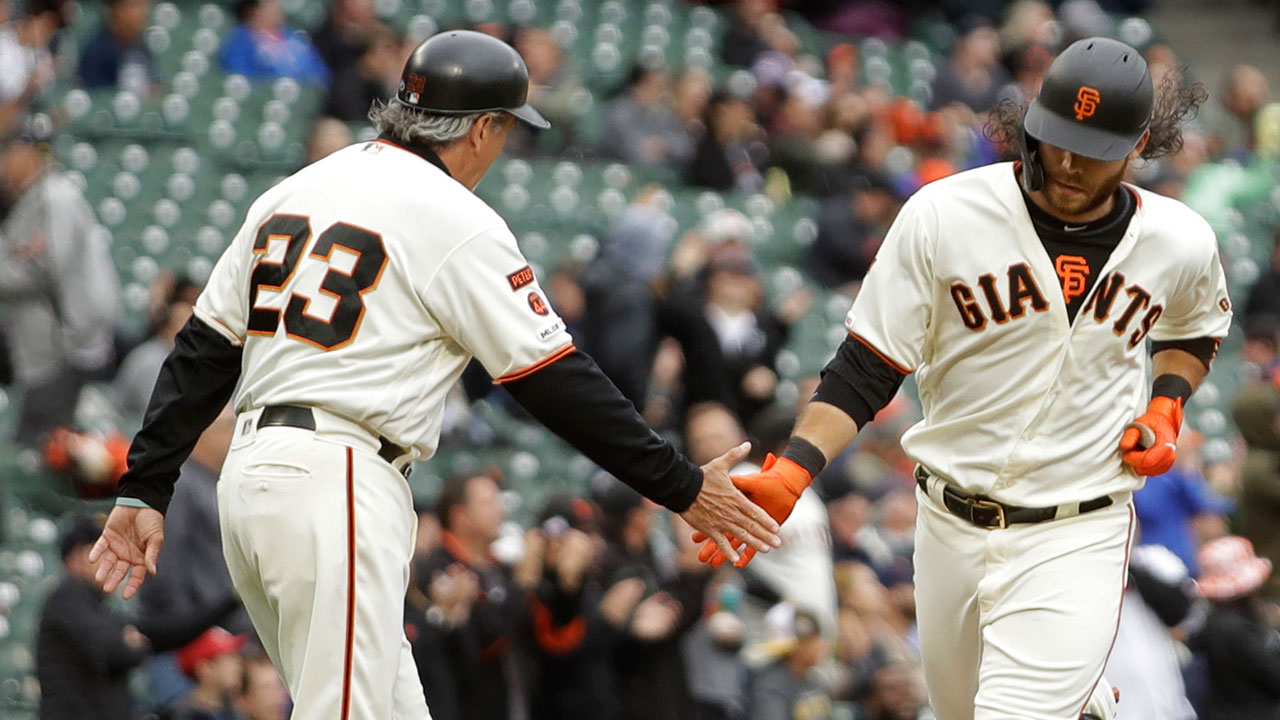 San Francisco Giants' Brandon Crawford, right, is congratulated after hitting a home run. (Ben Margot/AP)